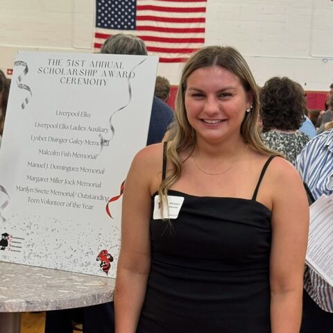 woman in white t-shirt and blue denim jeans sitting on brown cardboard box